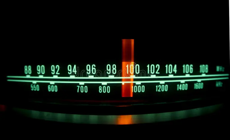 A close up of an analog radio meter