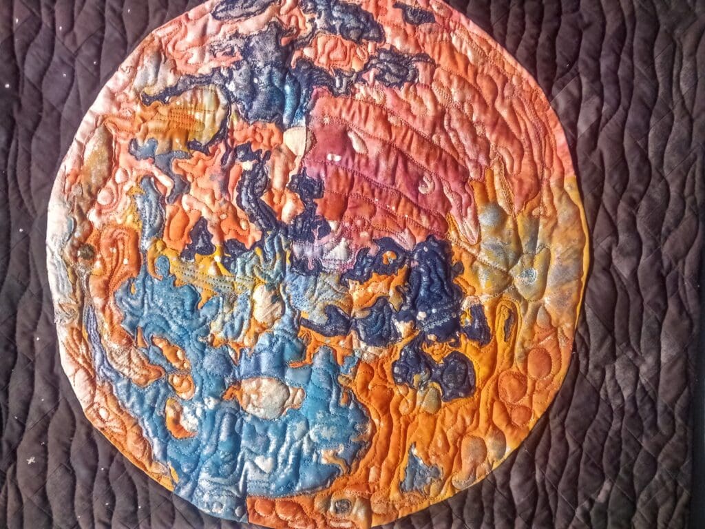 A close up of the earth in a quilt