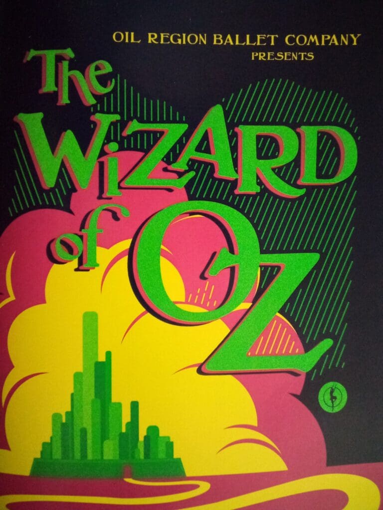 A wizard of oz book cover with the yellow brick road.