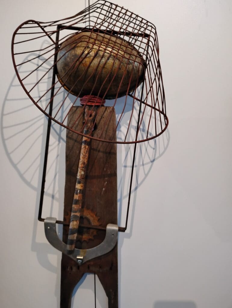 Metal and wood abstract art sculpture.