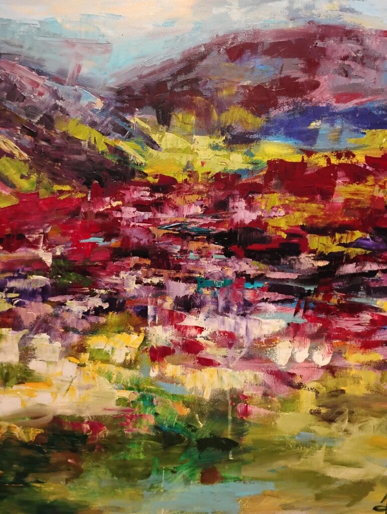 Colorful abstract landscape with mountains and fields.