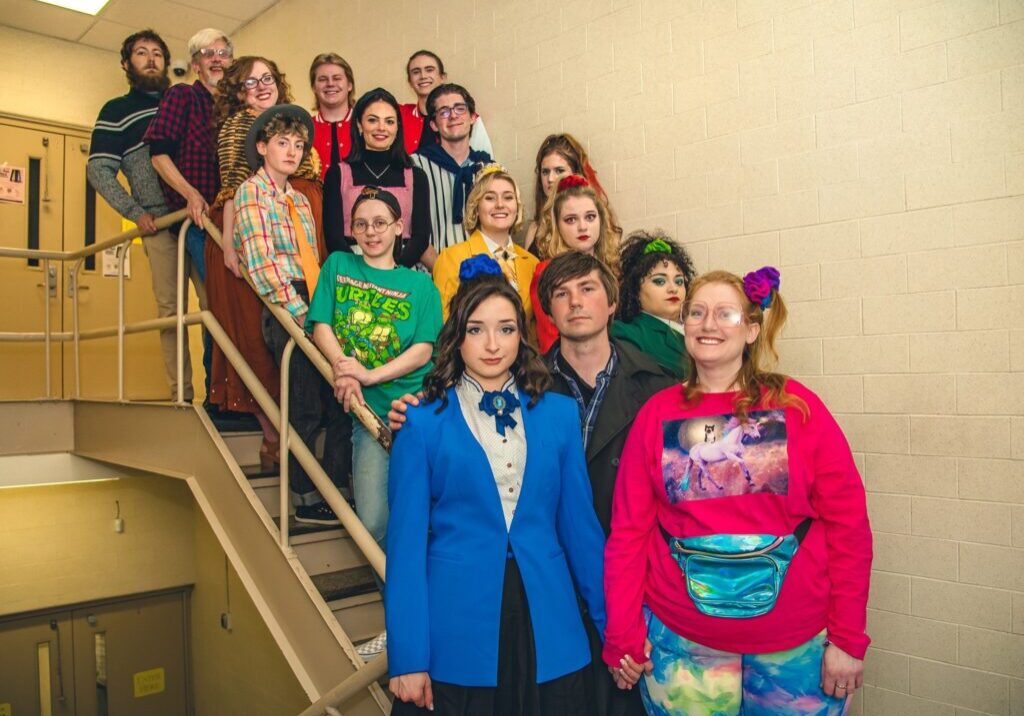 A group of people standing on the stairs