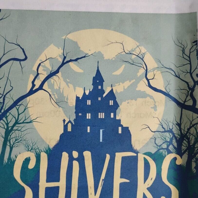 Haunted house silhouette with eerie moon background.