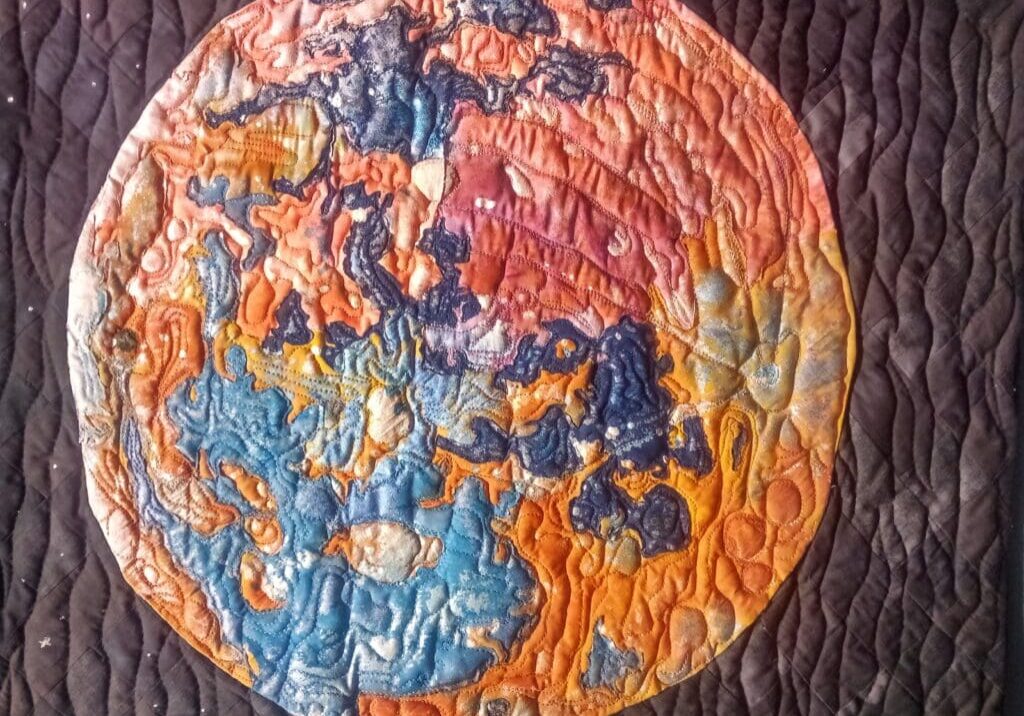 A close up of the earth in a quilt