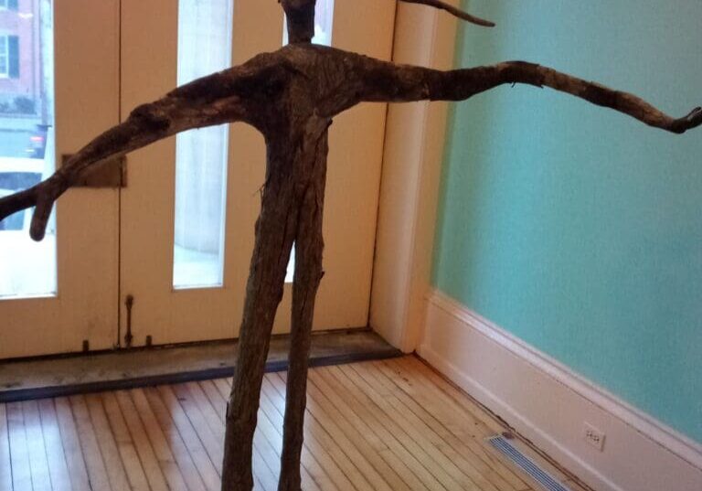A sculpture of a tree in the middle of a room.