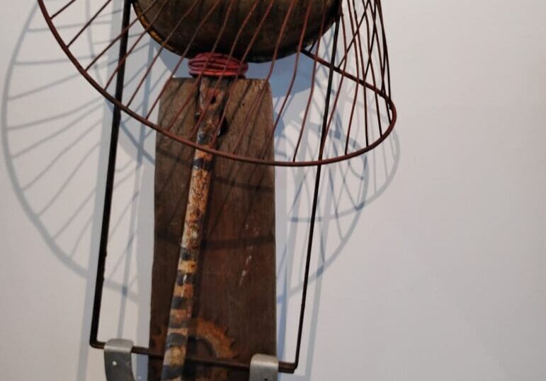 Metal and wood abstract art sculpture.